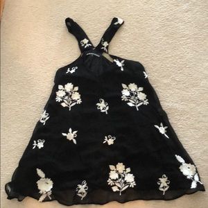 Black mini dress with white hand stitched flowers